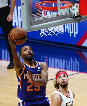 Suns' Mikal Bridges (25) makes a layup against Pelicans' Jose Alvarado during Game 6 of the first round of the Western Conference Playoffs.