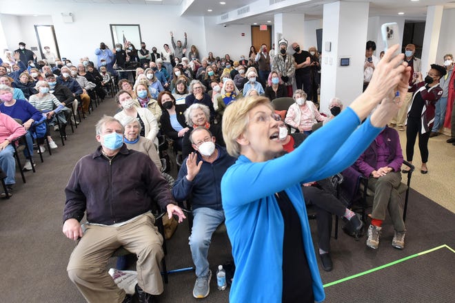 U.S. Sen. Elizabeth Warren takes a selfie with a capacity crowd during an afternoon visit to Chatham Community Center on Saturday. Steve Heaslip/Cape Cod Times