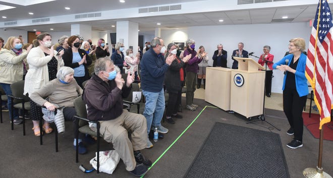 U.S. Sen. Elizabeth Warren gets a warm greeting from a capacity crowd during an afternoon visit to Chatham Community Center on Saturday. Steve Heaslip/Cape Cod Times