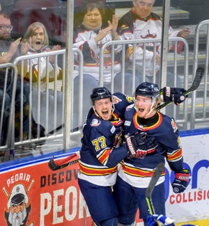 Peoria's Kasey Kulczycki, left, and Austin Wisely celebrate Kulczycki's goal in the first period of Game 2 of the SPHL finals Friday, April 29, 2022 at Carver Arena in Peoria. The Rivermen defeated the Roanoke Rail Yard Dawgs 7-3.