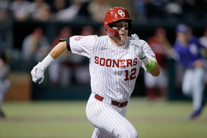 Oklahoma's Brett Squires (12) runs to first base after a hit in the sixth inning of a Big 12 baseball game between the University of Oklahoma Sooners (OU) and the Kansas State Wildcats in Norman, Okla., Friday, April 29, 2022. 