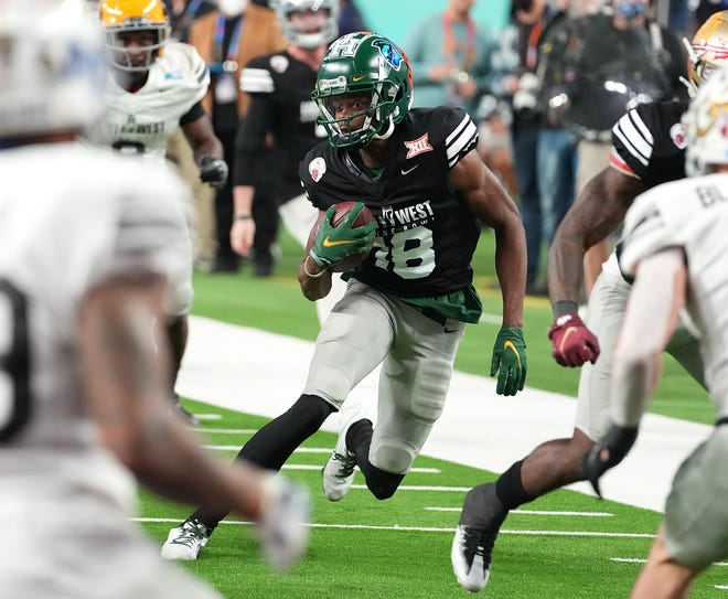 Feb 3, 2022; Las Vegas, NV, USA; West wide receiver Tyquan Thornton of Baylor (18) looks to gain yards after making a reception during the East/West Shrine Bowl at Allegiant Stadium. Mandatory Credit: Stephen R. Sylvanie-USA TODAY Sports