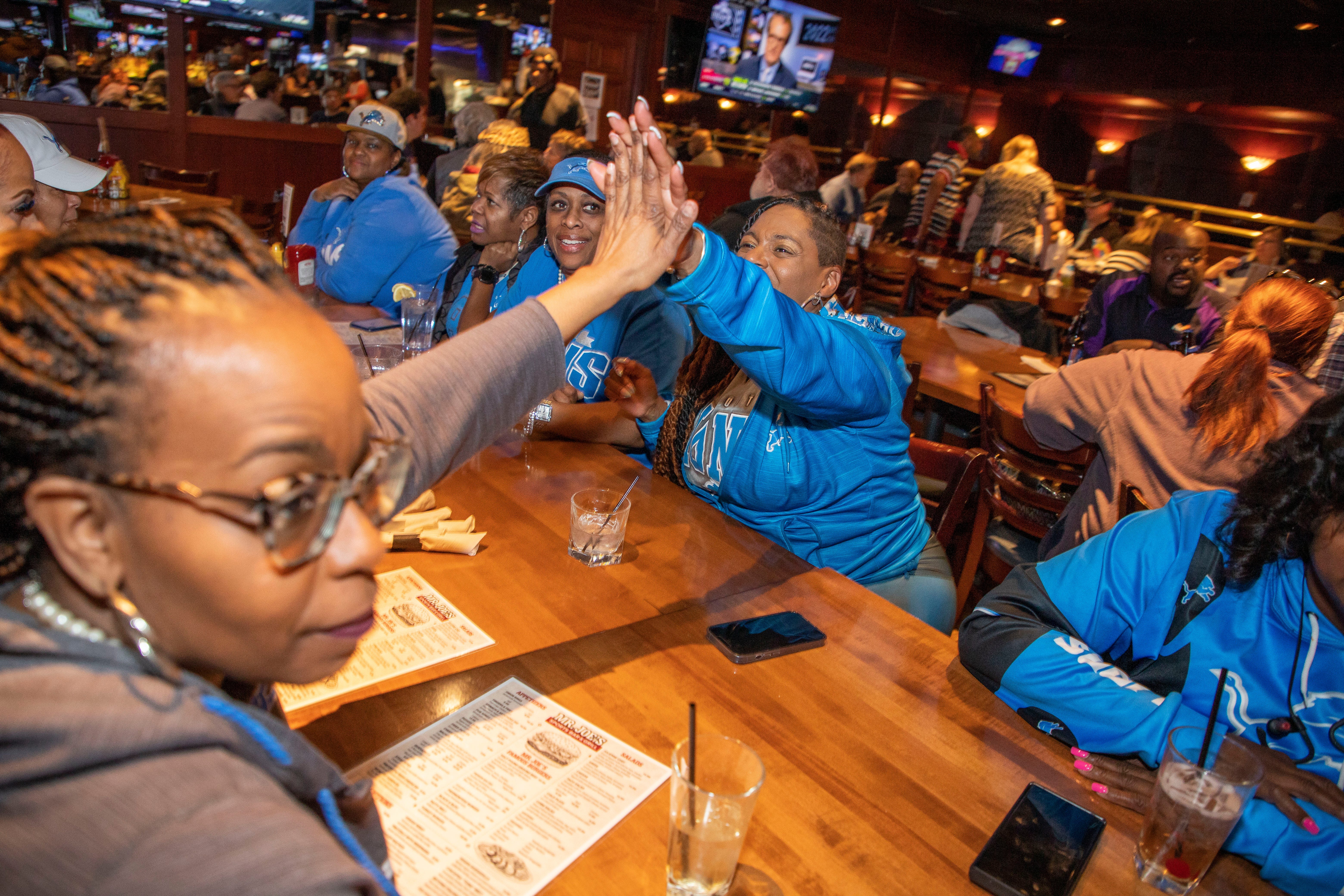 Day 2 of the NFL Draft on April 29, 2022, that brought 10 proud members of the Detroit Lions Tailgating Divas to Mr. Joe's Bar and Grill in Southfield. Before the Lions selected Kentucky defensive end Josh Paschal with the team's first pick of Day 2, the Divas celebrated their longtime friendships and even accepted a friendly challenge from another fan to sing the Lions fight song.