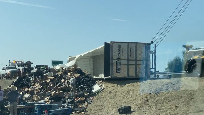 The overturned big rig which forced the closure of the Interstate 10 eastbound exit to Monterey Avenue.