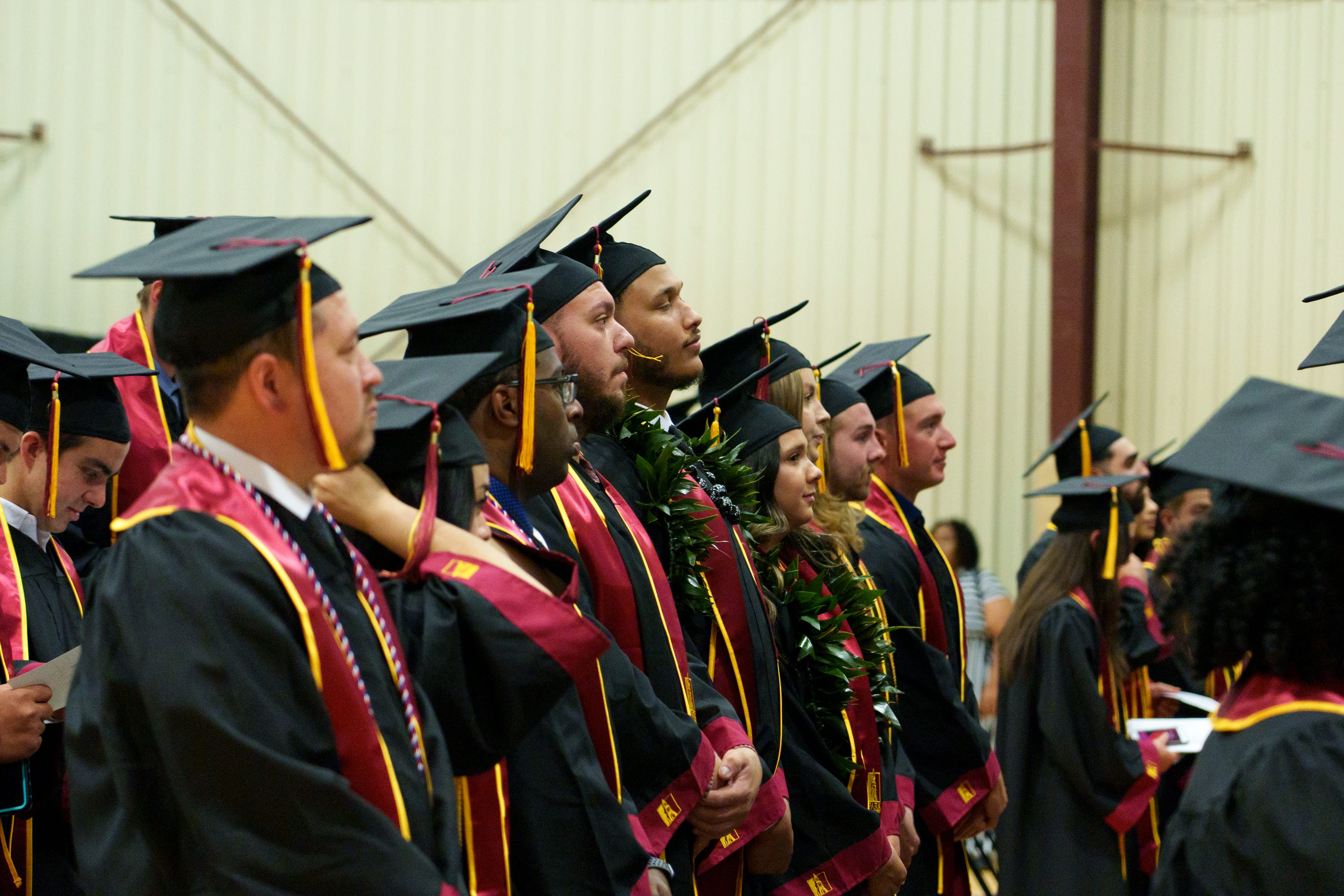 Graduates listen to speakers at Park University Gilbert's first commencement ceremony at Paloma Community Church on April 30, 2022, in Mesa.