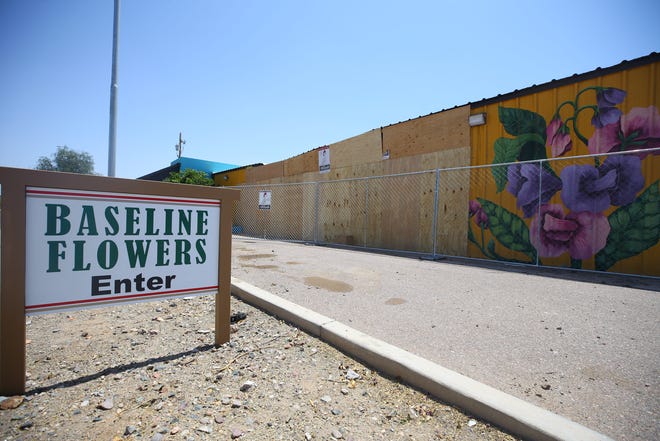 The damage to Baseline Flowers on Baseline Road in Phoenix, shown here on April 27, 2022, was caused by two vehicles that lost control and crashed into the building. Speed was a factor, Phoenix police say.
