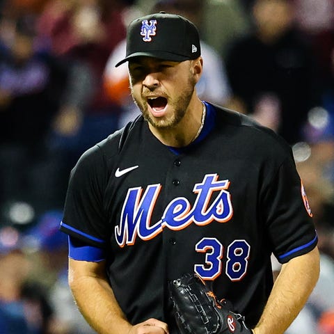 Mets pitcher Tylor Megill celebrates one of his fi