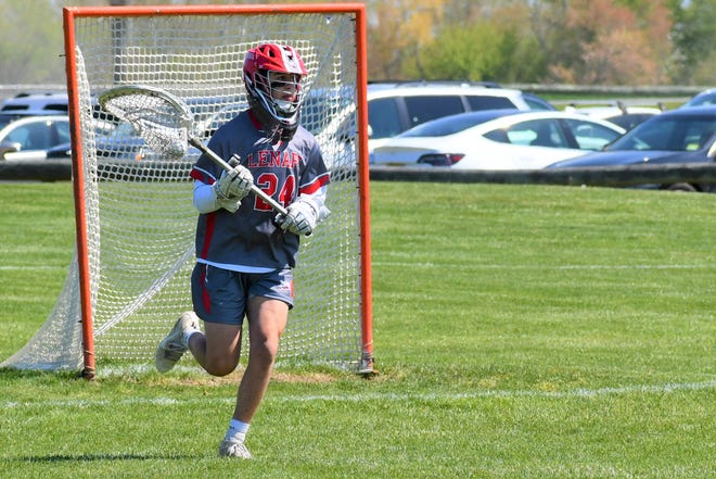 Lenape junior goalie Ben Blum leaves the circle to clear a ball against Clearview