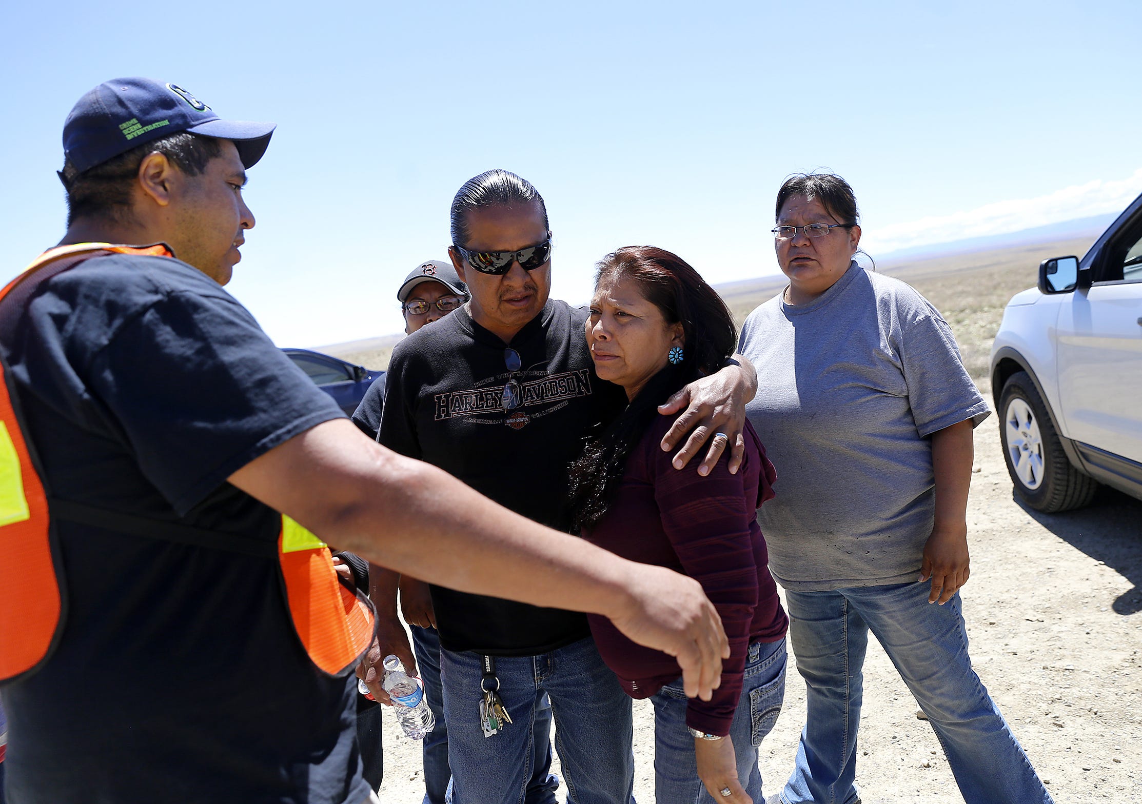 Family and friends gather on May 3, 2016 along Navajo Route 13 south of Shiprock, New Mexico just a few miles from where Ashlynne Mike's body was discovered.