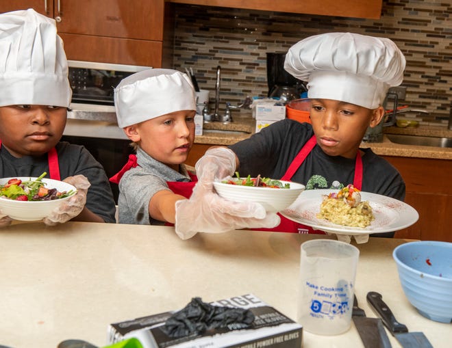 Young chefs plate their meals during last year's Junior Iron Chef Competition at Ever'man Cooperative Grocery.
