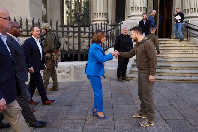 In this image released by the Ukrainian Presidential Press Office on Sunday, May 1, 2022, Ukrainian President Volodymyr Zelenskyy, centre right, and U.S. Speaker of the House Nancy Pelosi shake hands during their meeting in Kyiv, Ukraine, Saturday, April 30, 2022. Pelosi, second in line to the presidency after the vice president, is the highest-ranking American leader to visit Ukraine since the start of the war, and her visit marks a major show of continuing support for the country's struggle against Russia.