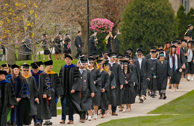 Faculty and graduating students of Adrian College's Class of 2022 make their way through campus May 1, 2022, during the college's spring commencement exercises. The Washington Post recently reported that nearly 20% of college graduates regret the major that they chose, with humanities graduates showing the most regret at nearly 50%.