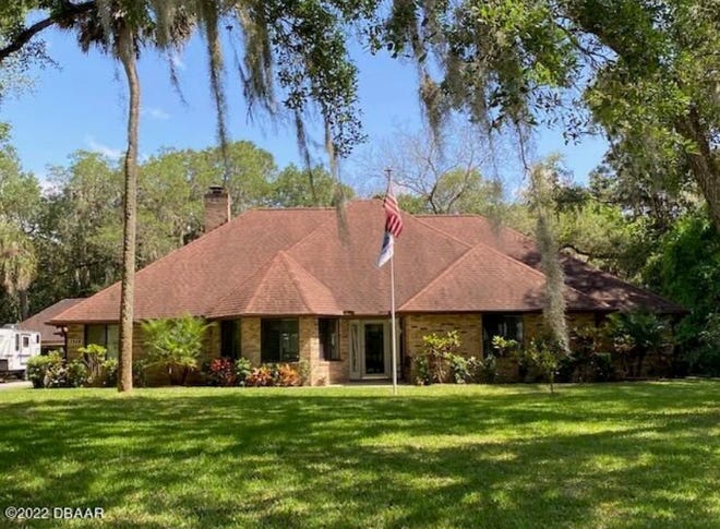 This custom-built, brick estate sits on over an acre of private land that feels like the country, yet is close to everything New Smyrna Beach has to offer.
