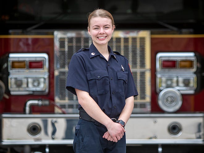 Galesburg's Hayley Stevenson poses for photos on her first day as a Galesburg firefighter at the Central Fire Department on Monday, May 2, 2022. Stevenson was sworn in early Monday as the first female firefighter in the department's history.