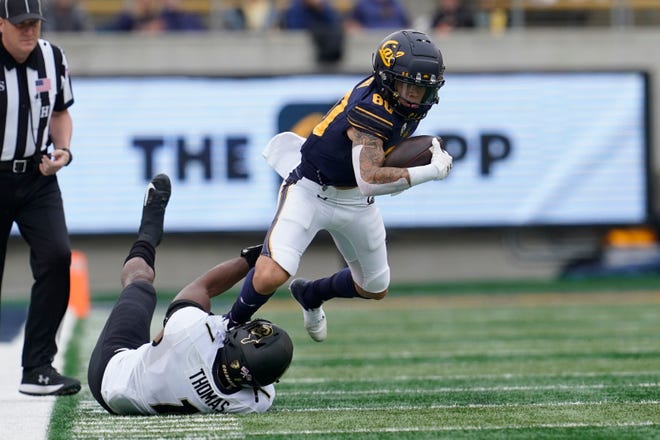 California wide receiver Trevon Clark, right, runs against Colorado linebacker Guy Thomas during an NCAA college football game in Berkeley, Calif., Saturday, Oct. 23, 2021.