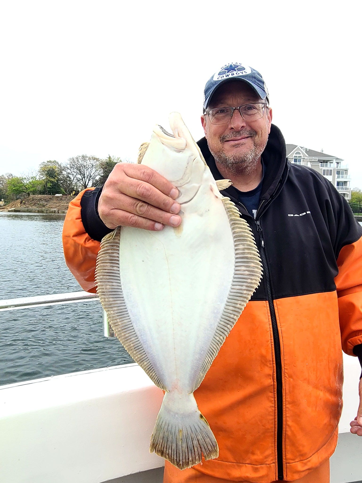 NJ fishing Rain doesn't stop netting the season's first fluke