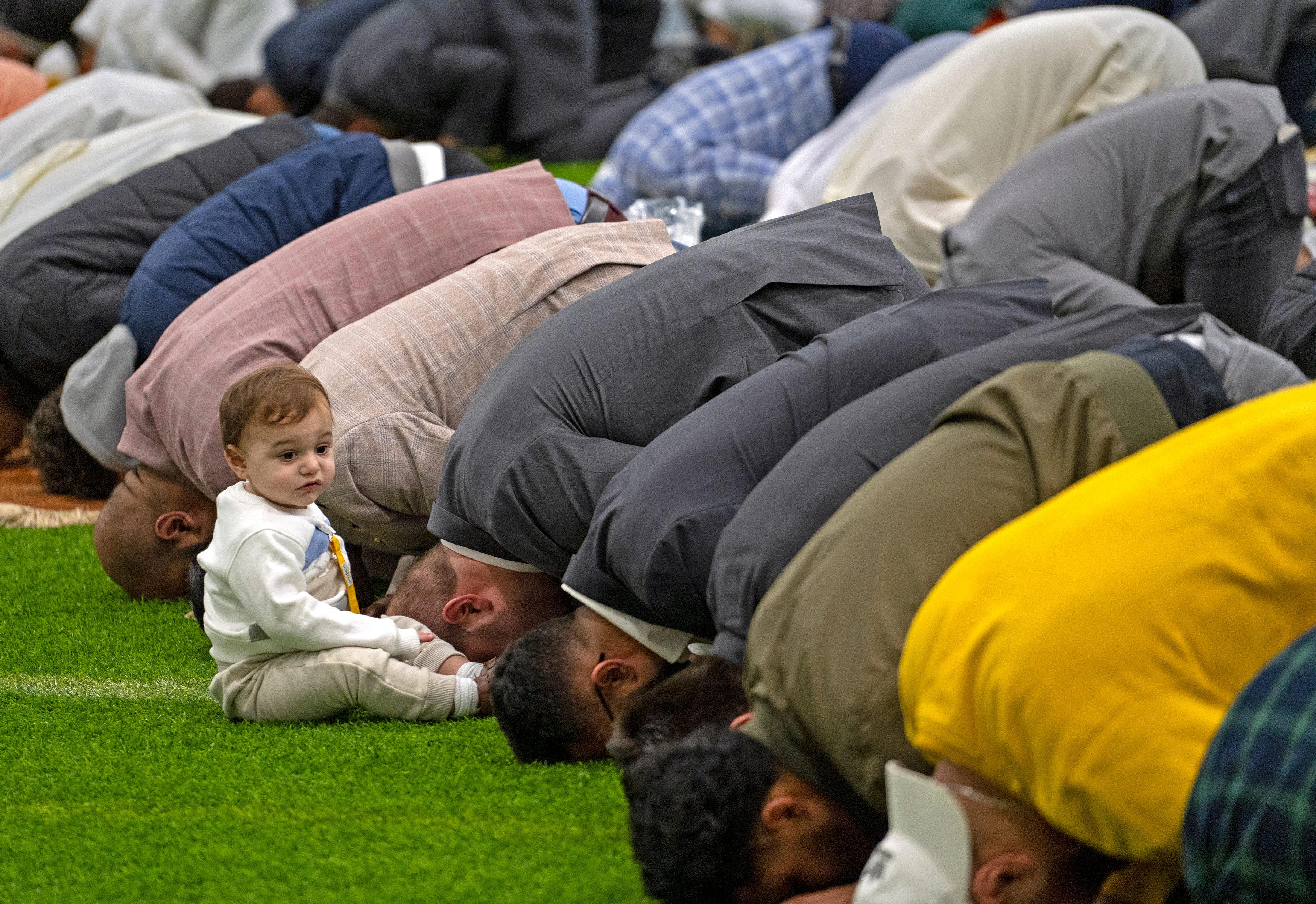 People pray to start the Eid Al-Fitr celebration Monday, May 2, 2022 at the Grand Park Sports Complex Events Center in Westfield. Prayers started the day as the Indiana Muslim community celebrated the end of the month-long dawn-to-sunset fasting of Ramadan.