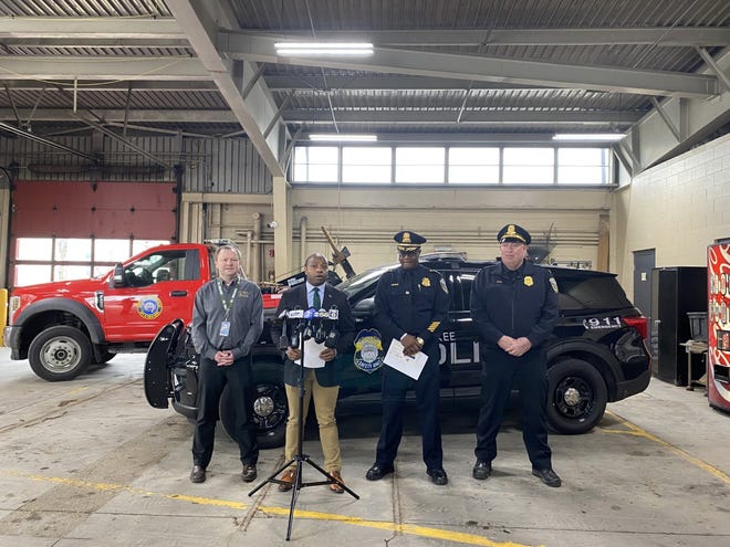 From left to right, Parking Services Manager Thomas Woznick, Mayor Cavalier Johnson, Police Chief Jeffrey Norman and Capt. Jeffrey Sunn discuss the city's new reckless driving towing measure at the city tow lot, 3811 West Lincoln Ave. Monday.
