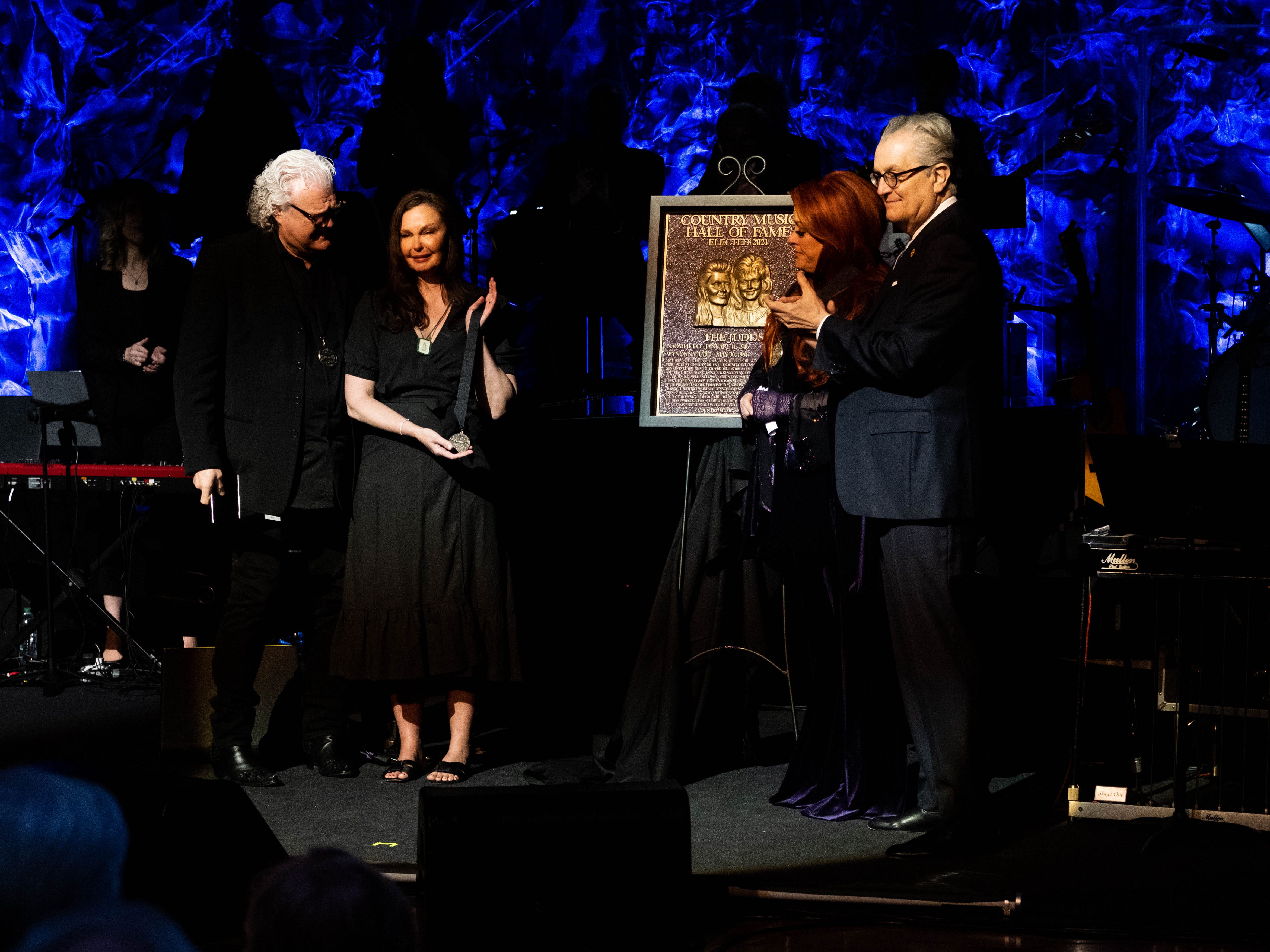 Wynonna Judd and her sister accept a medallion in honor of her mother Naomi Judd at the Country Music Hall of Fame and Museum in Nashville, Tennessee, on May 1, 2022. Their mother died Saturday, April 30, 2022.