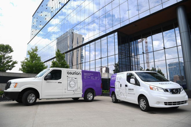 Asurion's services also include driving on site and help fix damaged cellphones or large appliances anywhere in Nashville, and working inside the white vans, pictured Friday, April 29, 2022.