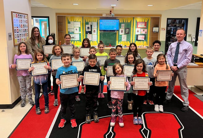 Wells Elementary School students who placed in this year’s Literary Achievement Awards.  At far left in the back row is WES Assistant Principal Theresa Curran.   At far right in the back row is WES Principal Kyle Burnell.