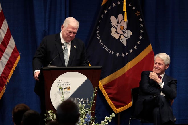 Former Mississippi Governor Haley Barbour, left, speaks during a Celebration of Life Ceremony honoring the late MS Governor William Winter and MS First Lady Elise Winter, as former former U.S. President Bill Clinton, right, listens at the Two Mississippi Museums on Tuesday, May 3, 2022 in Jackson, Mississippi.
