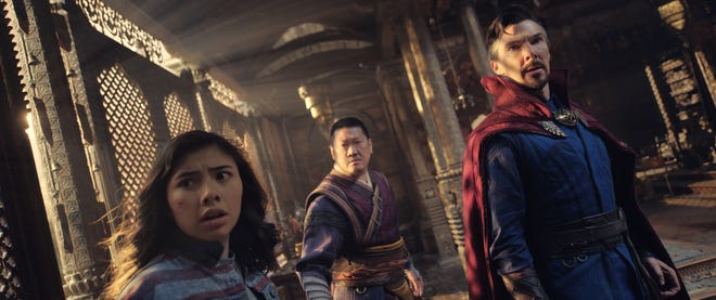 America Chavez (Xochitl Gomez, left) has backup in sorcerers Wong (Benedict Wong) and Stephen Strange (Benedict Cumberbatch) in "Doctor Strange in the Multiverse of Madness."