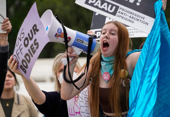 Protesters gather in Washington on Tuesday after a draft Supreme Court opinion published by Politico on Monday suggested the court is considering overturning the landmark 1973 Roe v. Wade decision.