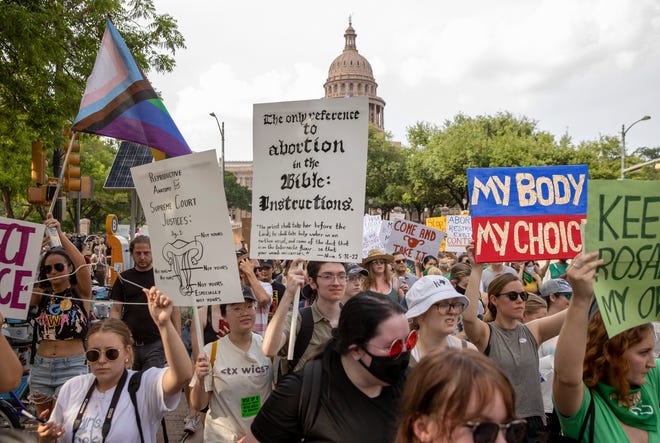 Protesters march from the Capitol to the United States Federal Courthouse to rally for abortion rights on May 3 in Austin.