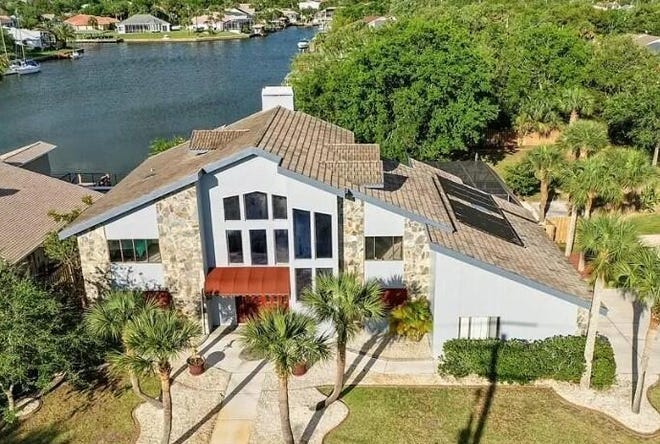 This house on Cimarron Drive, built in 1988, has five bedrooms and 4 1/2 baths in 4,036 square feet of living space. It also has a loft, a wood-burning fireplace, a screened pool and lanai with a summer kitchen, a boathouse and boat lift and skylights. It sold recently for $668,500.