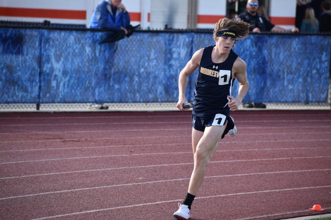 Mooresville's Nate Burns competes in the 4x800 relay at the Mid-State Conference Track and Field championship on May 3, 2022.