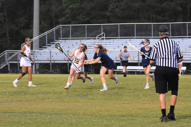 Richmond HIll's Danielle Lester (22 in white) looks to score against Pace Academy in a GHSA Class 1A-5A second-round playoff game May 3 at Wildcat Stadium. Richmond Hill won 22-21.
