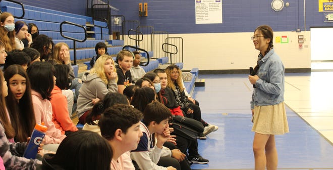 Northern State University student Cheng Chen speaks in front of the Simmons Middle School language club last week.