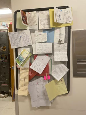 A wall of cards and letters of appreciation from patients.