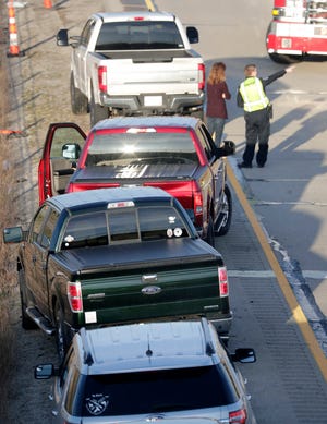 Law enforcement and emergency personnel on the scene of a series of crashes involving multiple vehicles on Interstate 41 northbound near the Richmond Street on ramp Tuesday in Appleton.