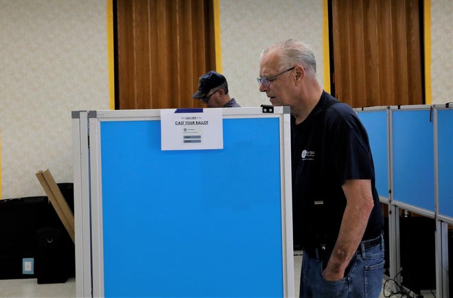 Richard LeFever votes during the Ohio primary election May 3 at the  St. Mark Catholic Church. Lancaster voters approved adding a new at-large member to Lancaster's city council, according to the unofficial results.