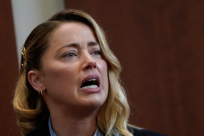 Actor Amber Heard testifies about the first time she says her ex-husband, actor Johnny Depp hit her, at Fairfax County Circuit Court during a defamation case against her by Depp in Fairfax, Virginia, on May 4, 2022.