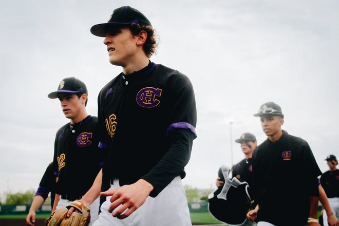 Hickman baseball junior Reiss Beahan (16) walks to the dugout after warming up prior to the Kewpies' 4-2 win over No. 1 Rock Bridge on Wednesday May 4, 2022, at Rock Bridge High School.