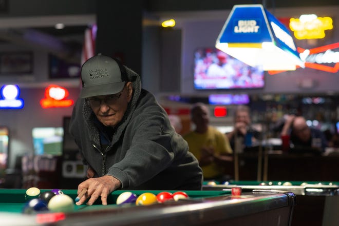 Willard Welch strikes the cue ball during a match Monday afternoon at Boulevard Billiards.