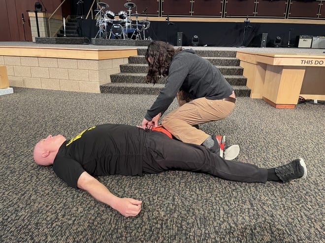 The FBI Des Moines Resident Agency hosted active shooter awareness and first aid training, which included hands-on practice tying tourniquets, at the New Hope Assembly of God church in Urbandale Thursday.