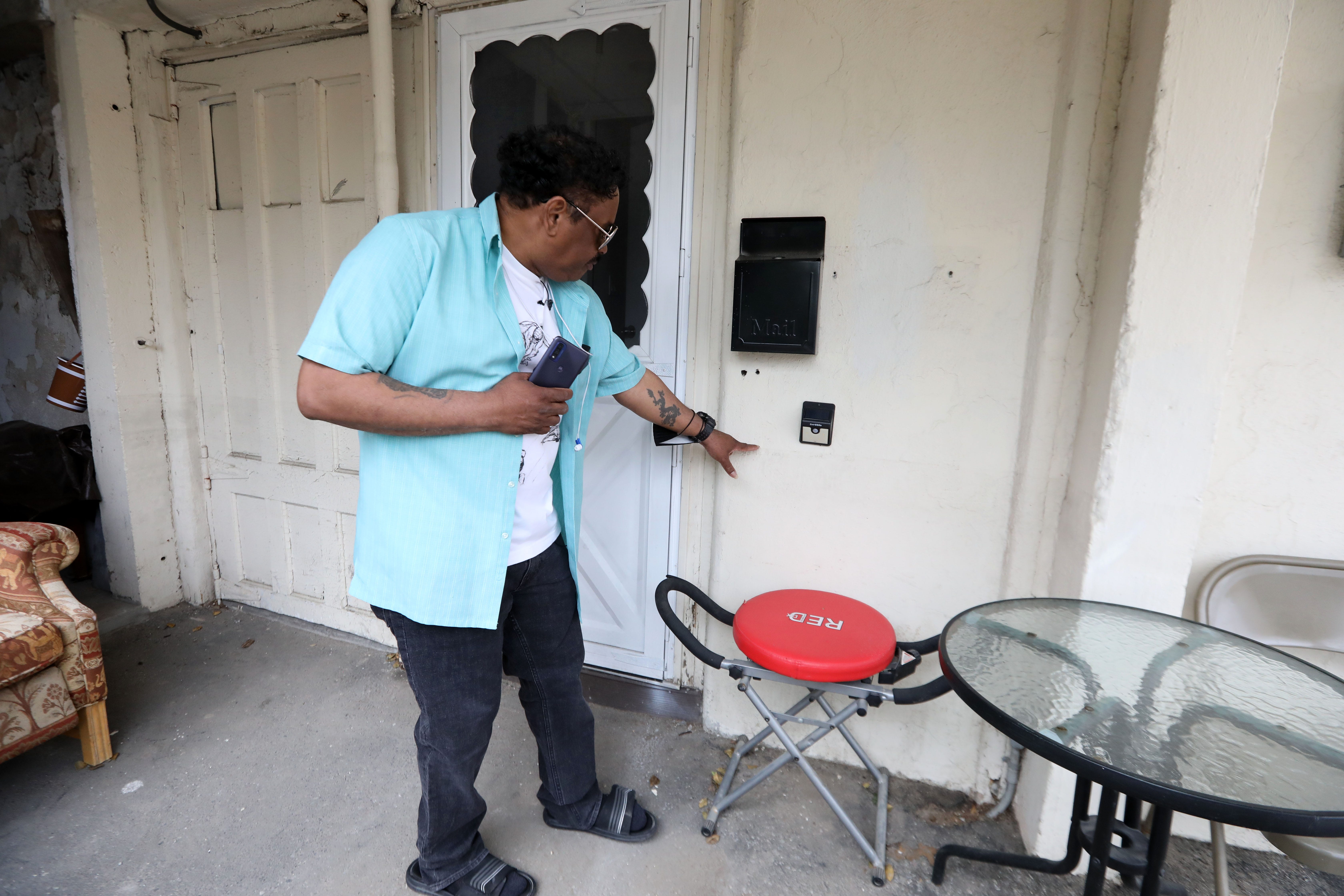 Randy Scott shows how high the water was at his door when it flooded from Hurricane Ida in Mamaroneck's Flats neighborhood, May 3, 2022. Scott escaped through his kitchen window after three neighbors banged on his window to get him to leave his apartment. 