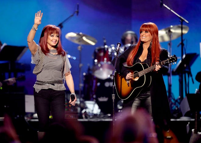 Naomi Judd, left, and Wynonna Judd, of The Judds, perform in Las Vegas in 2011.