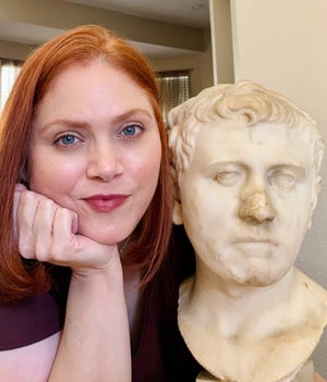Laura Young poses with a bust purchased at Goodwill in 2018.