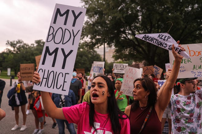 Libby Brooker, and Austin-area high school student, joins a crowd of protesters at the Texas Capitol on May 5, 2022. Hundreds of Texas students and community activists marched to protest a leaked Supreme Court draft suggesting the court could overturn Roe v. Wade, a landmark decision protecting women's liberty to choose to have an abortion.