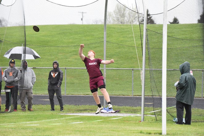 Morenci's Trey Nieman throws the discus during Thursday's Tri-County Conference tri-meet at Sand Creek.