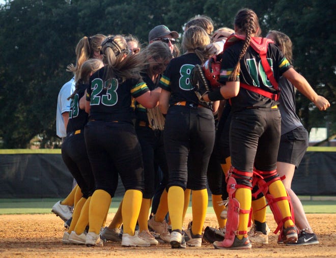 Yulee players and coaches swarm pitcher Riley Kapparis after she caught the decisive final out against Bishop Kenny during the District 3-4A Florida High School Athletic Association softball championship on May 5, 2022. [Clayton Freeman/Florida Times-Union]