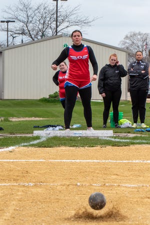 Oregon's Jenae Bothe watches as her shot put lands in the sand during the Big Northern Conference track and field meet on Thursday, May 5, 2022, in Rockford. Bothe won both the shot and discus titles.
