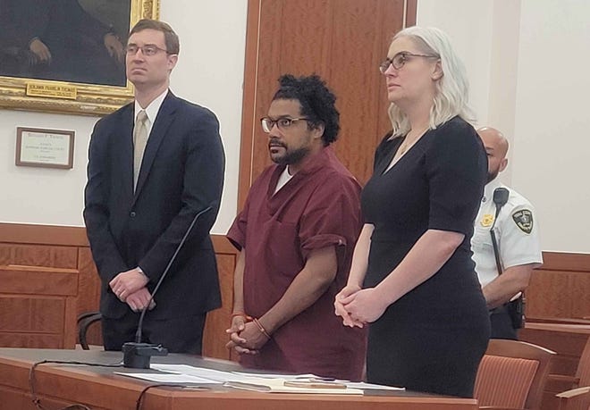 Ervin Pizarro, center, is sentenced Friday in Worcester Superior Court after he pleaded guilty to sexually assaulting two children.
