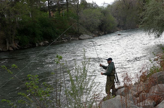 Aaron Sedway fishes a section of the Truckee River just west of Keystone Ave. in Reno on May 5, 2022.