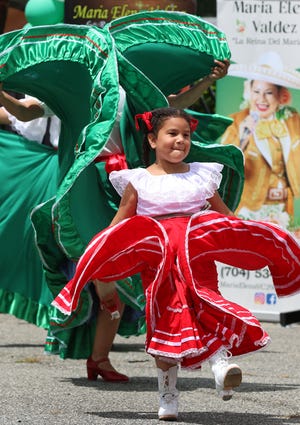 Six-year-old Angelina Abreu performs with the St. Michael’s Cultural Ministry Dancers during the Siete de Mayo festival held Saturday, May 7, 2022, at the Eastridge Mall in Gastonia.